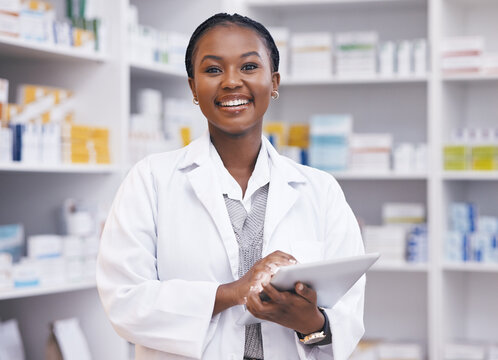Portrait of black woman in pharmacy with tablet, smile and online inventory list for medicine on shelf. Happy female pharmacist, digital checklist and medical professional checking stock in store.