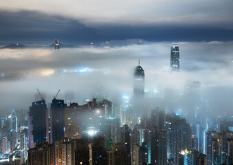 Fototapeta na wymiar Night scenery of skyline of Hong Kong city in fog