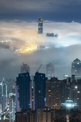 Night scenery of skyline of Hong Kong city in fog