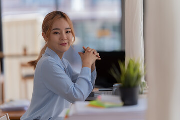 Businesswoman working in the office with paper files Data graph document to find and review cleared tasks still backlog. unsuccessful folder documents at office desk.