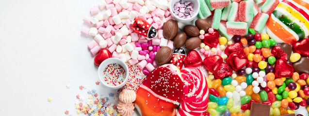 Various sweets assortment. Candy, bonbon, chocholate on white background.