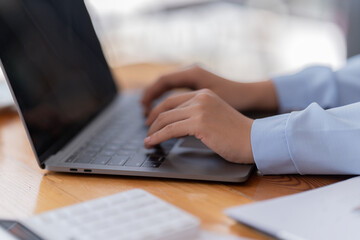 Business Documents concept : Employee woman hands working in Stacks paper files for searching and checking unfinished.