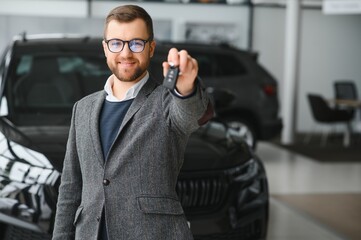 Man minded customer male buyer client in suit choose auto to go look aside want buy new automobile in car showroom vehicle salon dealership store motor show indoor Sales concept