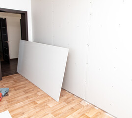 Sheets of drywall for the walls of the room. Repair