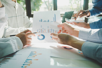 Businessmen working together at desk.