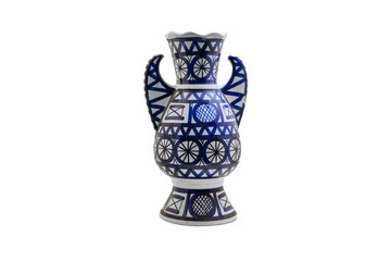 Large blue ceramic vase with Arabic patterns, isolated on a white background. White with blue abstract pattern amphora stands in a niche wall. Vase in Arab style, on a pedestal.