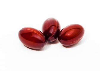 Three medicine gel capsules on white background, sedative pills group