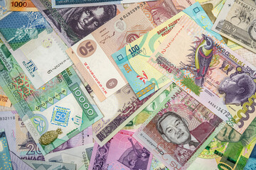 African money are scattered on the table so that it is completely covered.