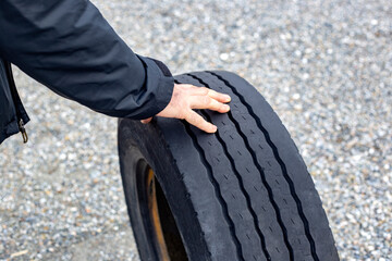 Fototapeta premium hands of man is changing the wheel