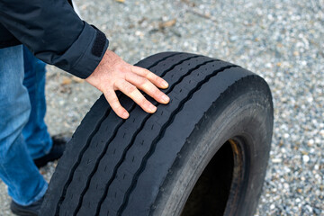 Fototapeta premium hands of man is changing the wheel