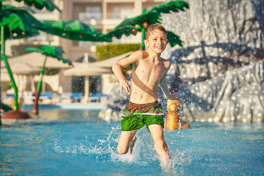 Picture of young boy playing in outdoor aqua park