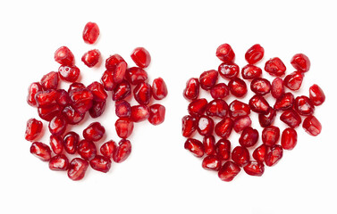 red pomegranate seeds isolated on white background