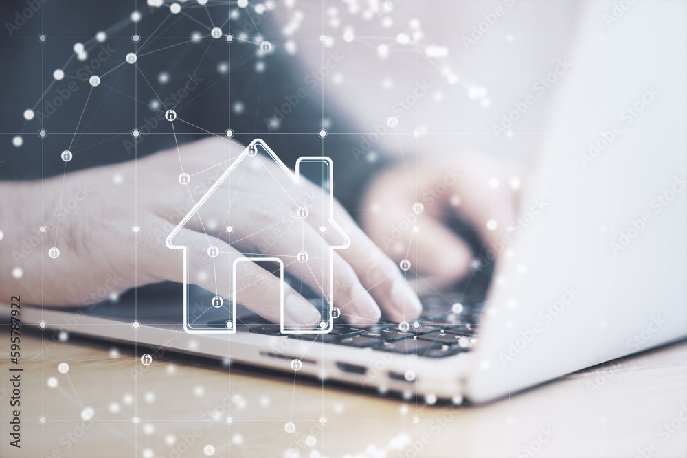Poster close up of businessman hand using laptop keyboard with polygonal sphere with house hologram on blur