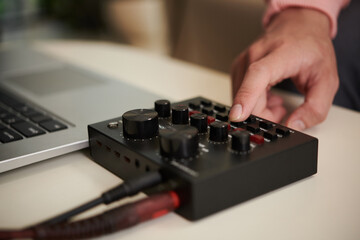 Guitar player using amplifier when recording new song at home