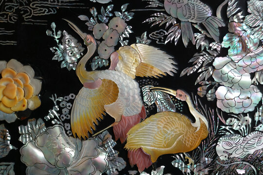 lacquerware inlaid with mother-of-pearl: A wooden dish or furniture decorated by attaching seashell pieces of a fine color in different shapes and then lacquering them.