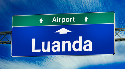 Road sign indicating direction to the city of Luanda - obrazy, fototapety, plakaty