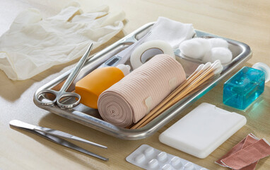 Emergency first aid kit on wooden table Horizontal composition, top view healthcare and medical