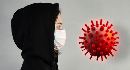 Girl and virus, microbe, bacterium. A face in a medical mask and a model of a flying virus.