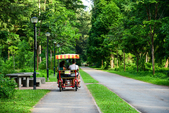 Family cycling at Changi Beach Park, Singapore