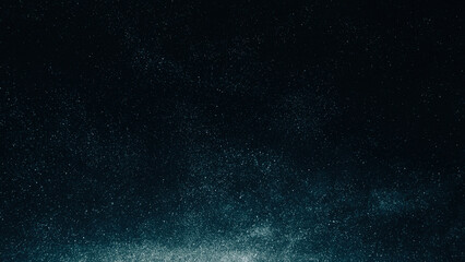 Dust overlay. Particles texture. Night sky. Galaxy stars. Blue white glowing flour grain noise on dark black abstract background.