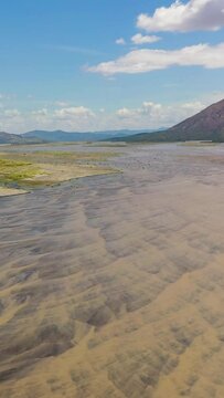 A shallow river bed in a mountain valley. Bucao river. Luzon, Philippines.