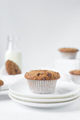 Homemade chocolate chip muffins with selective focus, bakery style chocolate chip muffins with white liners