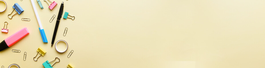 Banner Flat lay office supplies on yellow background