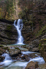 Fototapeta premium Long Exposure of ‘Jenbach’ Waterfall in ‘Jenbachtal’in Bavaria, Germany, Europe