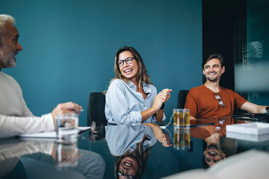 Group of successful business people having a collaborative meeting in a boardroom