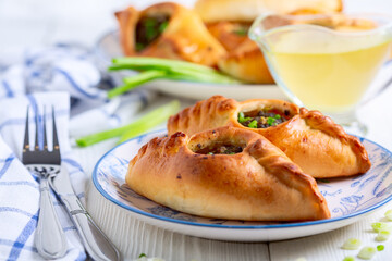 Two open pies with savory filling (rastegay). Russian kitchen.