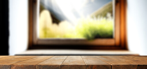 Desk of free space and spring window background in home interior. 