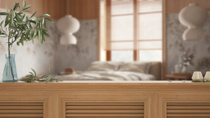 Wooden table top, cabinet, panel or shelf with shutters close up. Olive branch in vase and candles....