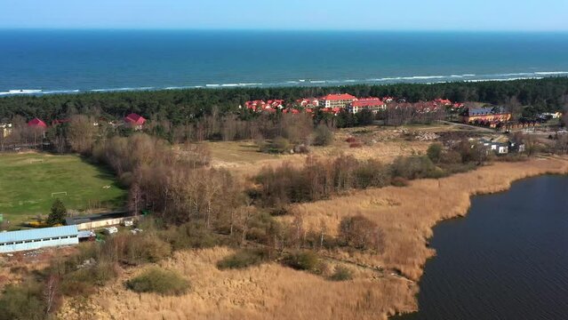Aerial view of the village of Dzwirzyno near Kołobrzeg in Poland with the Baltic Sea coast, holiday homes and hotels