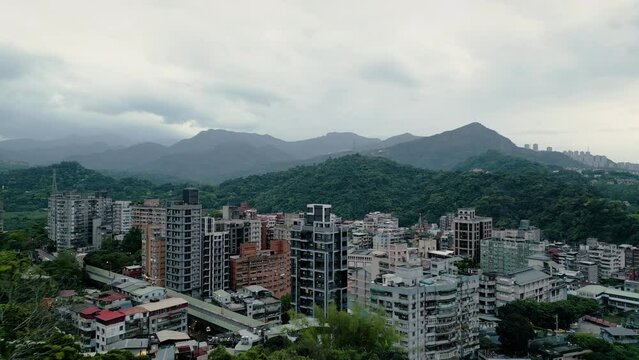 Xindian District Urban City surrounded by Nature and Mountains in the Outskirts of Taipei on a Cloudy Day