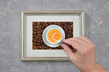 Hand Holding Cup Of Cappuccino Coffee Inside of Classic Frame