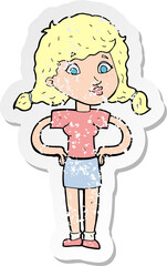 retro distressed sticker of a cartoon pretty girl with hands on hips