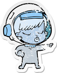 distressed sticker of a cartoon pretty astronaut girl pointing