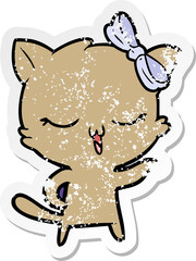 distressed sticker of a cartoon cat with bow on head