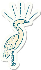worn old sticker of a tattoo style standing stork