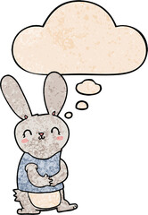 cute cartoon rabbit with thought bubble in grunge texture style