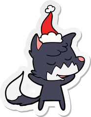 friendly hand drawn sticker cartoon of a fox wearing santa hat