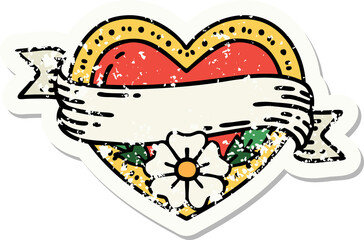 distressed sticker tattoo in traditional style of a heart and banner with flowers