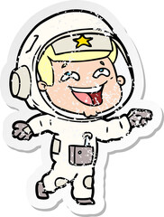 distressed sticker of a cartoon laughing astronaut