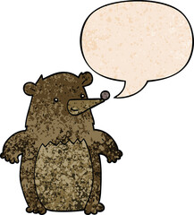 cartoon bear with speech bubble in retro texture style
