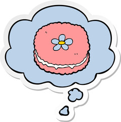 cartoon biscuit with thought bubble as a printed sticker