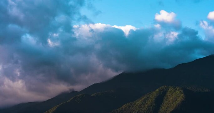 Timelapse of Blue Sky with Rolling Clouds Over Mountain at Sunrise or Sunset