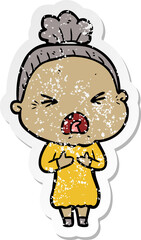 Obraz premium distressed sticker of a cartoon angry old woman