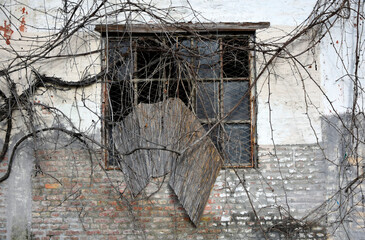Old window of abandoned building. Old wall background