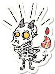 worn old sticker of a tattoo style skeleton demon character
