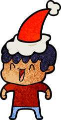 hand drawn textured cartoon of a laughing boy wearing santa hat